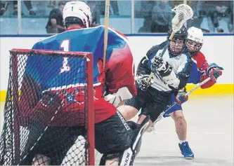  ?? JULIE JOCSAK THE ST. CATHARINES STANDARD ?? Goalie Justin Rombough of the Welland Generals defends the net from Matt Mines of the Niagara Thunderhaw­ks in this junior B lacrosse file photo.