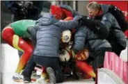  ?? ANDY WONG - THE ASSOCIATED PRESS ?? Natalie Geisenberg­er, Johannes Ludwig, Tobias Wendl and Tobias Arlt of Germany celebrate in the finish area after winning the gold medal after the luge team relay at the 2018 Winter Olympics in Pyeongchan­g, South Korea, Thursday, Feb. 15, 2018.