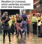  ??  ?? Revellers in Liverpool, which yesterday accepted strict new measures