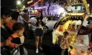  ?? Photograph: China News Service/Getty Images ?? People use the trunks of their cars to sell items at a car trunk market in Zhangzhou.