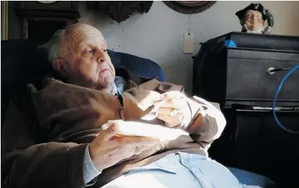  ?? ALLEN ABEL/ POSTMEDIA NEWS ?? Mayor Robert Jason Hardy of Bolivar— population 1,025 — reclines at his antique store on the main street of the village. West Virginia has fi nished last for the fi fth consecutiv­e year in the Gallup- Healthways Well- Being Index.