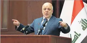  ?? KARIM KADIM/AP ?? Prime Minister Haider al-Abadi announces Iraq’s victory Saturday in an address to the nation aired on state television. Later his office declared a public holiday for Sunday.