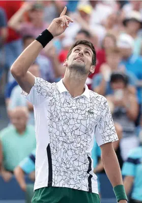  ?? Picture: AFP ?? FINALLY. Novak Djokovic celebrates beating Roger Federer in the final of the Western &amp; Southern Open in Mason, Ohio on Sunday.