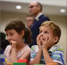  ?? SEAN KILPATRICK, THE CANADIAN PRESS ?? Bryson Boyce-Pettes, 5, and Eleonore Alamillo-Laberge, 6, take part in a press conference on early learning and child care.