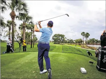  ?? RICHARD GRAULICH / THE PALM BEACH POST ?? Louis Oosthuizen tees off on No. 11 during Wednesday’s pro-am. Heavy rain that arrived later in the day has officials expecting “a softer course on the greens and fairways” for today’s first round.