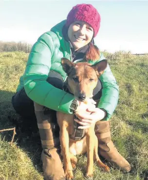  ??  ?? Emily Harvey, a trainer for Guide Dogs Cymru, rescued Tui the dog from Thailand