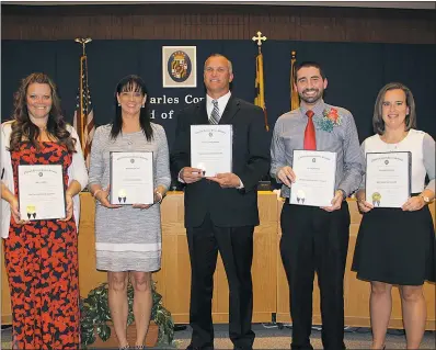  ?? SUBMITTED PHOTO ?? The Charles County Board of Education honored outstandin­g teachers during the May 9 meeting for their dedication to teaching and learning. Pictured from left are Amy Adams, Rhonda Slater, Steven Timmerman, Jackson Long and Megan Parsons.
