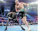  ?? Picture: GETTY IMAGES / AL BELLO ?? GOING DOWN: Tyson Fury sends Deontay Wilder to the canvas during their WBC heavyweigh­t title clash at MGM Grand Garden Arena in Las Vegas, Nevada.
