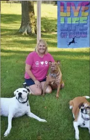  ?? SUBMITTED PHOTO ?? Jill Schadler of Royersford, owner/operator of Off the Leash Dog Truck is seen in this photo with ‘her pack,’ from left to right: rescues Gus, Faith and Candy. Schadler’s new food truck caters to the canines — offering healthy and homemade dogs treat that are made locally.