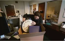  ?? Rich Pedroncell­i / Associated Press ?? Gina Frisby, chief of staff for Assembly Member Evan Low, packs up his office last month in advance of the upcoming demolition of the Capitol Annex.