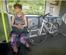  ?? PHOTOS: ROBERT KITCHIN/STUFF ?? Train user Elizabeth Scott says people are wary of saying the wrong thing to strangers, so it can be easier to stay quiet.