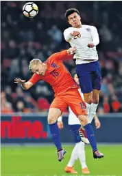  ??  ?? Stalling star: Dele Alli (right) did not look as if he had the world at his feet in a less-than-stellar substitute’s showing against Holland