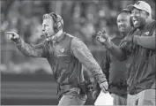  ??  ?? A TOUCHDOWN in the third quarter brings out the excitement in Rams coach Sean McVay, left.