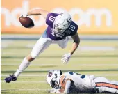  ?? RAOUX/AP
JOHN ?? Northweste­rn wide receiver Riley Lees tries to leap over Auburn defensive back Jaylin Simpson during the second half of the Citrus Bowl on Friday in Orlando, Fla.