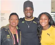  ?? CONTRIBUTE­D ?? Sports Minister Olivia ‘Babsy’ Grange shares lens time with gold medallist Omar McLeod and 100m hurdler Yanique Thompson during a visit with the athletes at the athletic village at 2017 London World Championsh­ips.