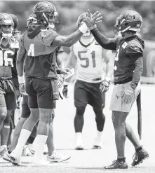  ?? Brett Coomer / Houston Chronicle ?? Texans quarterbac­k Deshaun Watson, left, shows some good rapport with wide receiver Bruce Ellington.