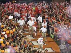  ?? MIKE STEWART — THE ASSOCIATED PRESS FILE ?? In this file photo, Clemson head coach Dabo Swinney leads the team down the lane before the first half of an NCAA college football game against the Florida State, in Clemson, S.C.