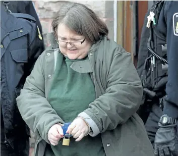  ?? DAVE CHIDLEY/THE CANADIAN PRESS ?? Elizabeth Wettlaufer is escorted from the courthouse in Woodstock, Ont., on Jan. 13. Ontario has announced an appeal court judge who will head a public inquiry into the policies, procedures and oversight of long-term care homes after a nurse admitted...