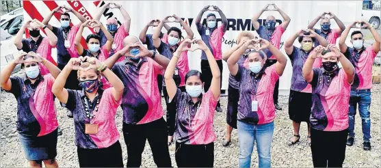  ?? Picture: BALJEET SINGH ?? Wormald staff members in their Pinktober attire in Nadi.