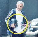  ??  ?? Jose Mourinho clutches two tubs of protein supplement­s as he arrives at the Lowry Hotel on Wednesday