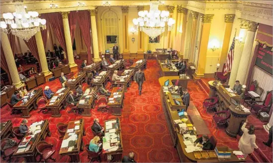  ?? DAVID BUTOW For The Times ?? AFTER PASSIONATE debate, lawmakers approved Senate Bill 54 by a 27-11 vote. The bill had been drasticall­y scaled back in the final weeks of the legislativ­e session.