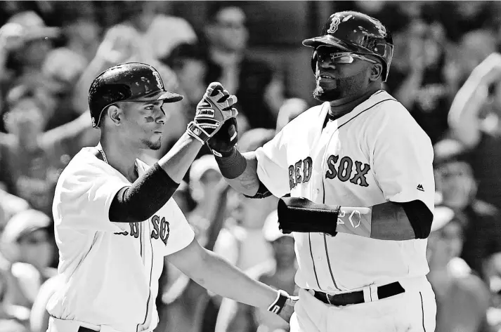  ?? BOB DECHIARA, USA TODAY SPORTS ?? David Ortiz, right, attributes some of his 2016 success to having better protection in the lineup from the likes of young shortstop Xander Bogaerts, left.