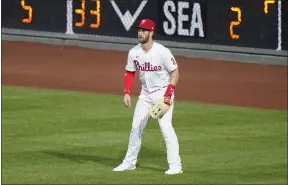  ?? MATT SLOCUM - THE ASSOCIATED PRESS ?? Bryce Harper was out again Wednesday night, making it three absences in a row with that bothersome wrist injury. Phillies manager Joe Girardi left open a window of a possible return Thursday for Harper.