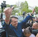  ?? FERNANDO SOUZA AGENCE FRANCE-PRESSE ?? Jair Bolsonaro lors d’un bain de foule à Rio de Janeiro, dimanche