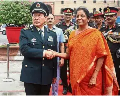  ??  ?? New deal: Wei shaking hands with Sitharaman before their meeting in New Delhi, India. — Reuters