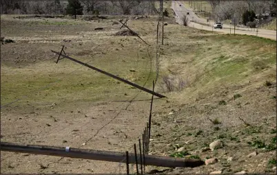  ?? MATTHEW JONAS — STAFF PHOTOGRAPH­ER ?? Broken utility poles are seen along U. S. 36 between Lefthand Canyon Drive and Nelson Road in Boulder County after high winds were reported over the weekend on Monday, April 8.