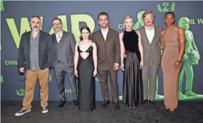  ?? MONICA SCHIPPER/GETTY IMAGES ?? At the premiere of “Civil War” on April 2 in Los Angeles are, from left, Alex Garland, Nick Offerman, Cailee Spaeny, Wagner Moura, Kirsten Dunst, Jesse Plemons and Jojo T. Gibbs.