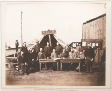  ??  ?? A vintage print features H.T. Devine's photo of Vancouver's first council meeting outside a tent in September 1886. The Neelands Brothers mounted the print in an album for the print's owner, James Dixon Townley.