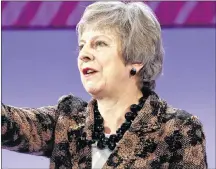  ?? AP PHOTO ?? Britain’s Prime Minister Theresa May gestures as she delivers a speech at the CBI annual conference in London, Monday.