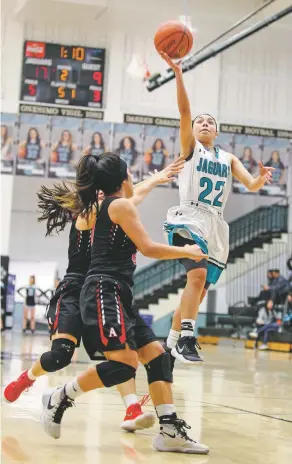  ?? GABRIELA CAMPOS/NEW MEXICAN FILE PHOTO ?? ABOVE: Miranda Cortez plays for the Lady Jaguars earlier this year against Albuquerqu­e Academy. She’s been on the varsity team since eighth grade and has served as a team captain for three years.