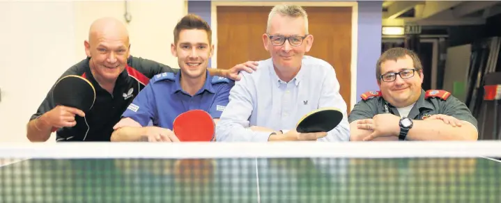  ??  ?? Table Tennis player Mike Jones, centre, with, from left, Robbie Beck, PCSO Mark Rodgers and paramedic Kevin Smith who saved his life after he suffered cardiac arrest at Ouston Community Centre