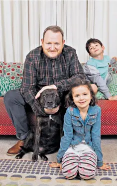  ??  ?? Family man: Michael Hogan with his children Charlie and Kitty, and their dog Roxie