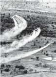  ?? U.S. Air Force planes spray the defoliant chemical Agent Orange over vegetation in Vietnam.
AP ??