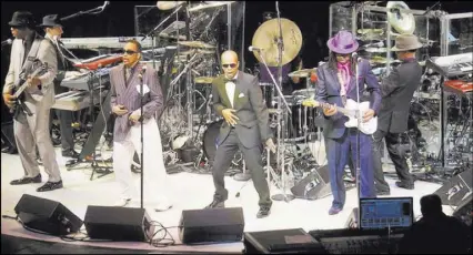  ?? COURTESY ?? Thomas Austin, center, now performs as Jerome alongside the real Morris Day, left, after years of doing the same character in the tribute band Purple Reign. “They gonna love us no matter what,” Day told him.