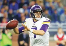  ?? THE ASSOCIATED PRESS ?? Minnesota Vikings quarterbac­k Case Keenum throws during the first half of Thursday’s game against the Lions in Detroit.