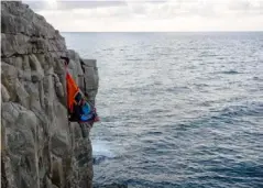  ??  ?? Guests are held to the cliff face by a harness