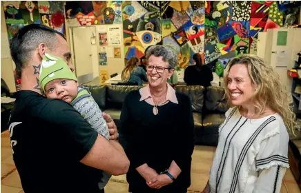  ?? PHOTOS: WARWICK SMITH/STUFF ?? Carol Searle, centre, pictured with Dayne Rademakers, who is holding 7-week-old Kingston. Holly Greenston stands right.