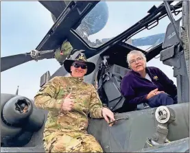  ?? Contribute­d ?? 6/6 Commanding Officer Beau Rollie shows Chris McKeever, museum executive director, the drone technology of the AH-64D Apache helicopter.