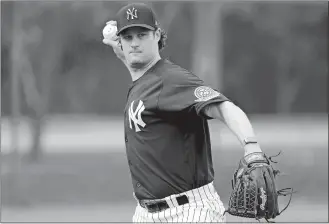  ?? FRANK FRANKLIN II/AP PHOTO ?? In this Feb. 13 file photo, New York Yankees pitcher Gerrit Cole throws to first base during a spring training workout in Tampa, Fla.