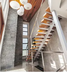  ??  ?? This airy staircase serves as the spine of this contempora­ry space. Saanichton architect Silvia Bonet always looks at staircases with an artistic eye.