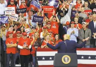  ?? Stephen Maturen / Getty Images ?? President Trump gestures to the crowd during a campaign rally Thursday in Minneapoli­s.