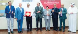  ?? — supplied photo ?? Dr Thumbay Moideen and other officials during the ceremony to mark GMU'S 24th anniversar­y.