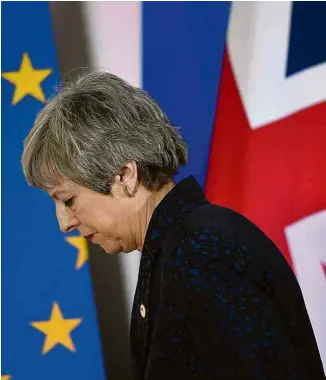  ?? Emmanuel Dunand/AFP ?? A primeira-ministra britânica, Theresa May, durante encontro em Bruxelas