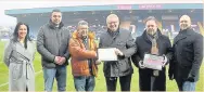  ??  ?? ●●Rochdale In Bloom members Paul Ellison, Roy Down and Coun Phillip Massey with Frances Fielding, Chris Dunphy and Russ Green from Rochdale FC