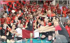  ??  ?? (Left) QOC Second Vice-President Dr Thani bin Abdulrahma­n al Thani presents the Amir Cup Volleyball Championsh­ip trophy to Al Rayyan team in Doha on Saturday. (Right) Al Rayyan players, officials and fans celebrate with the trophy.