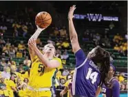  ?? Rod Aydelotte/Associated Press ?? Baylor forward Caitlin Bickle, left, scored 19 points in the Bears’ victory over TCU at Waco.